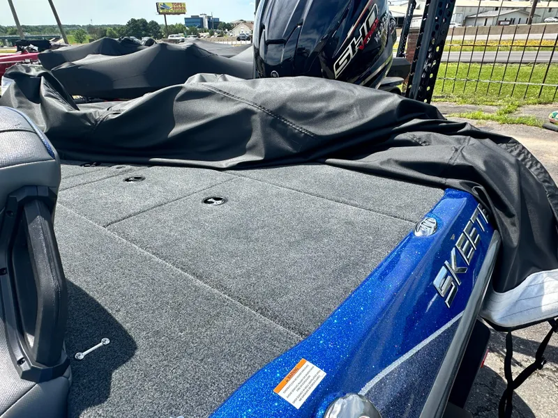Slide: The Image of 2024 Skeeter ZXR21 boat with Yamaha engine, blue and gray deck. - 5