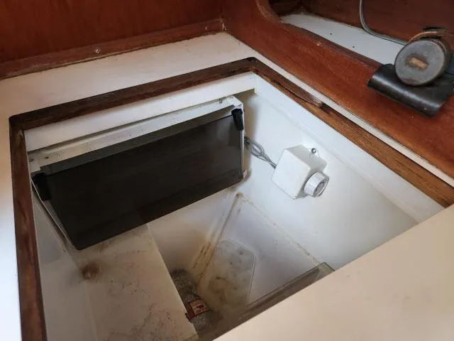 Slide: The Image of Open storage compartment in 1985 Catalina 36 sailboat. - 14