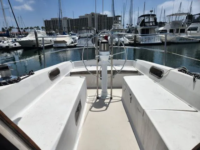 Slide: The Image of Cockpit of 1985 Catalina 36 sailboat docked in marina with other boats. - 26