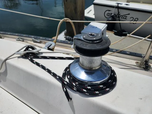 Slide: The Image of Winch and rope on 1985 Catalina 36 sailboat deck, docked near Catalina 28. - 27