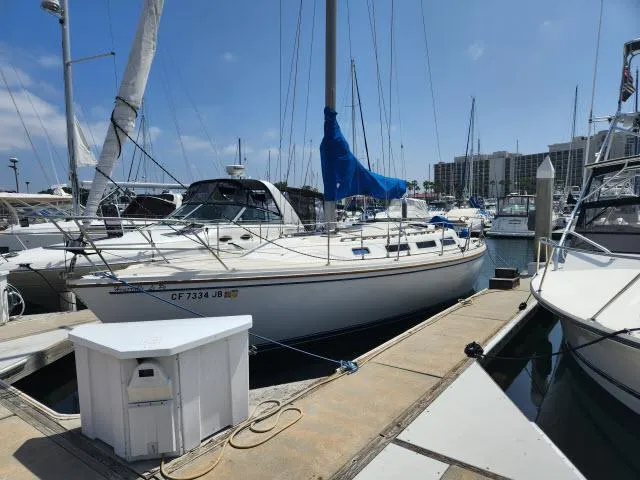 Slide: The Image of 1985 Catalina 36 sailboat docked at marina on a sunny day. - 40