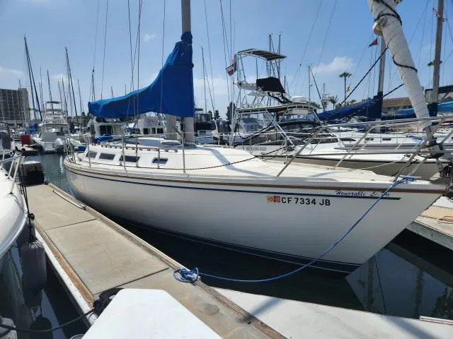 Slide: The Image of 1985 Catalina 36 sailboat docked at marina. - 43