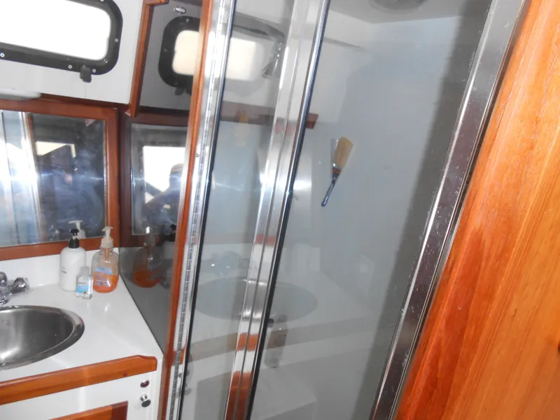 Slide: The Image of Bathroom interior of 1989 Cooper Marine Prowler 9m boat with sink and shower. - 15