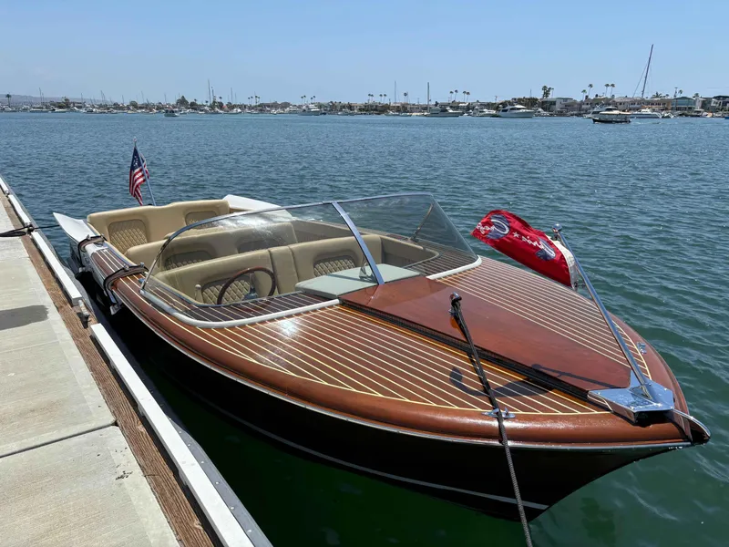 Slide: The Image of 1960 Chris-Craft Continental Gull Wing boat docked on a sunny day. - 0