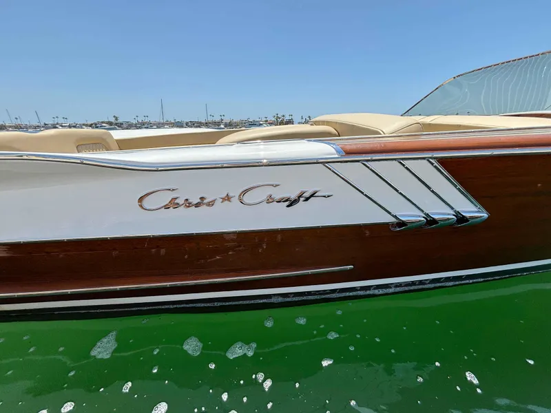 Slide: The Image of 1960 Chris-Craft Continental Gull Wing boat on water, showcasing classic design. - 5