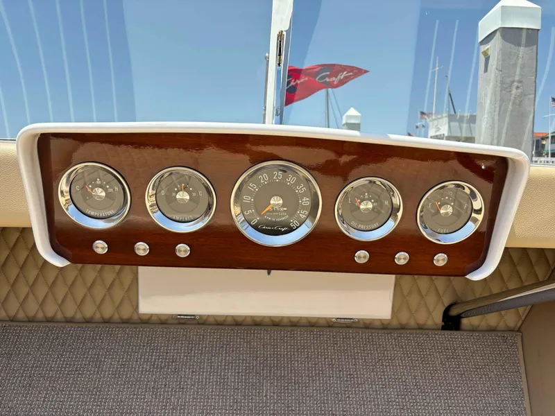 Slide: The Image of 1960 Chris-Craft Continental Gull Wing dashboard with vintage gauges and wood finish. - 9