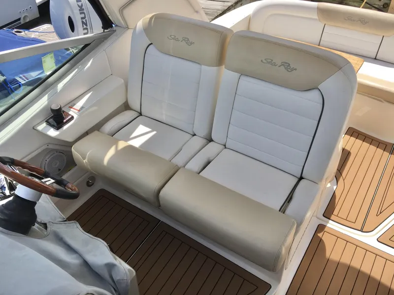 Slide: The Image of Luxury seating on 2010 Sea Ray 330 Sundancer boat with beige and white upholstery. - 14