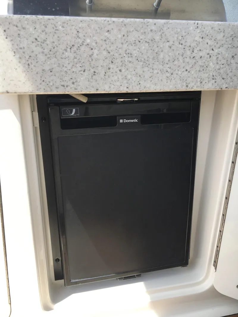 Slide: The Image of Compact Dometic refrigerator in 2010 Sea Ray 330 Sundancer boat galley. - 19