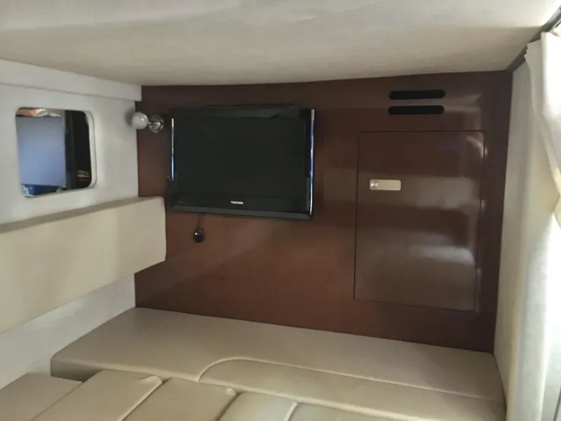 Slide: The Image of Interior cabin of 2010 Sea Ray 330 Sundancer with TV and seating area. - 29
