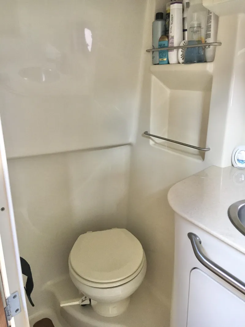 Slide: The Image of Compact bathroom in 2010 Sea Ray 330 Sundancer boat with toilet and sink. - 30