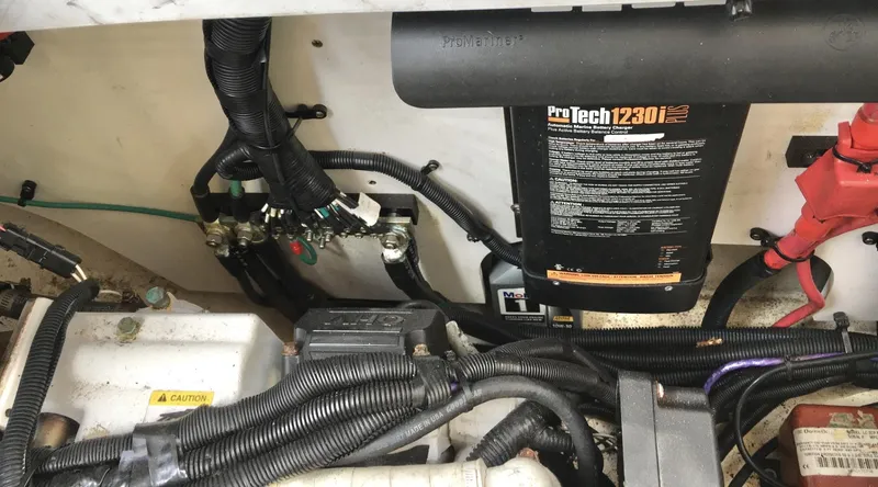 Slide: The Image of Engine compartment of a 2010 Sea Ray 330 Sundancer with ProTech 1230i battery charger. - 33