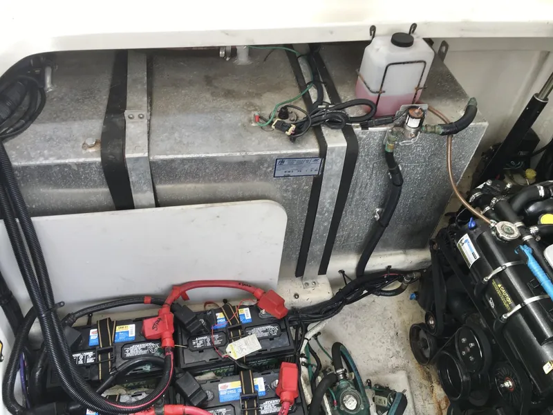 Slide: The Image of Engine compartment of a 2010 Sea Ray 330 Sundancer with batteries and fuel tank. - 34