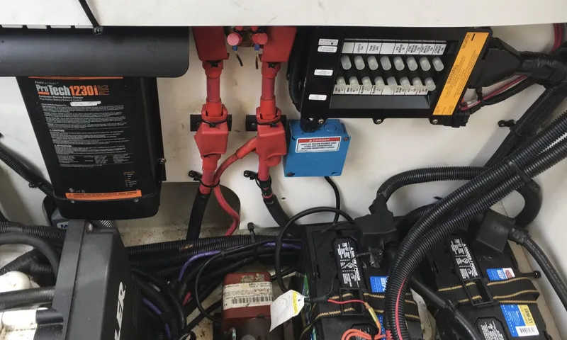 Slide: The Image of Electrical system of a 2010 Sea Ray 330 Sundancer boat, featuring batteries and wiring. - 36