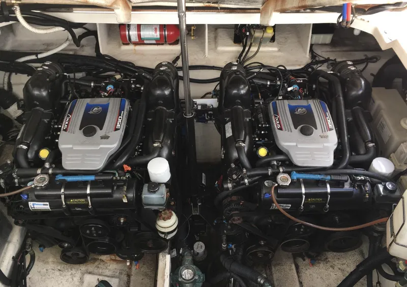 Slide: The Image of Twin engines of a 2010 Sea Ray 330 Sundancer boat in the engine compartment. - 39