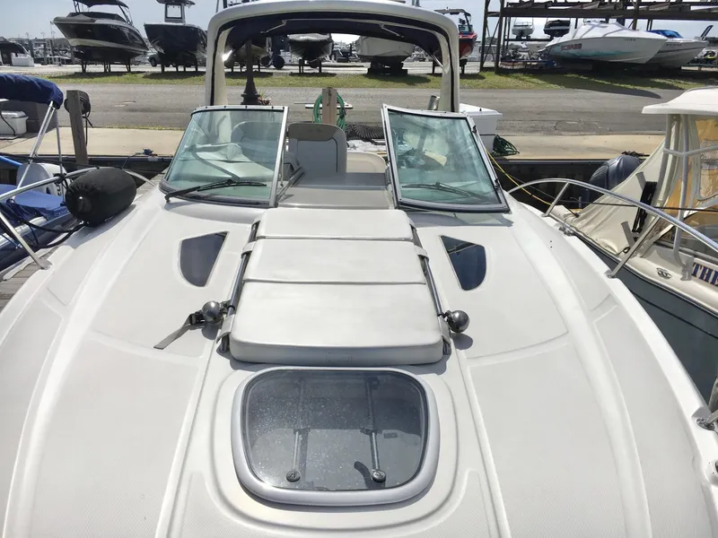 Slide: The Image of 2010 Sea Ray 330 Sundancer boat deck with open windshield and hatch. - 4