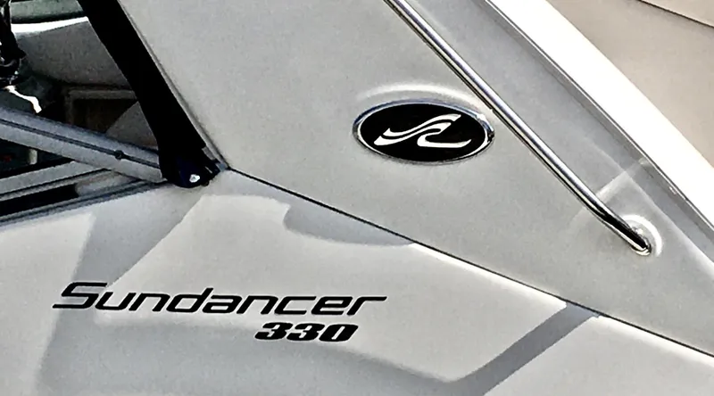 Slide: The Image of Sea Ray 330 Sundancer 2010 boat logo and model name on hull. - 8