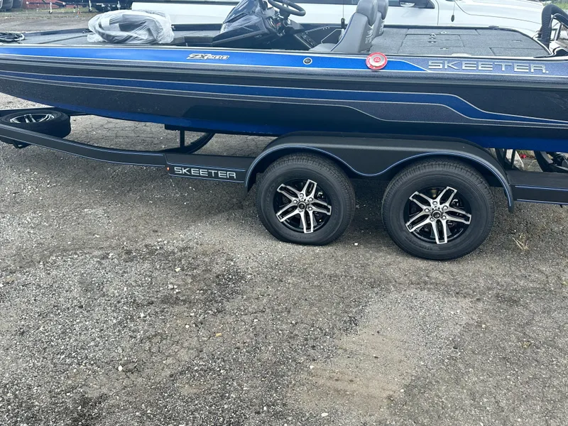 Slide: The Image of 2024 Skeeter ZX200 boat on a trailer with dual axles. - 1