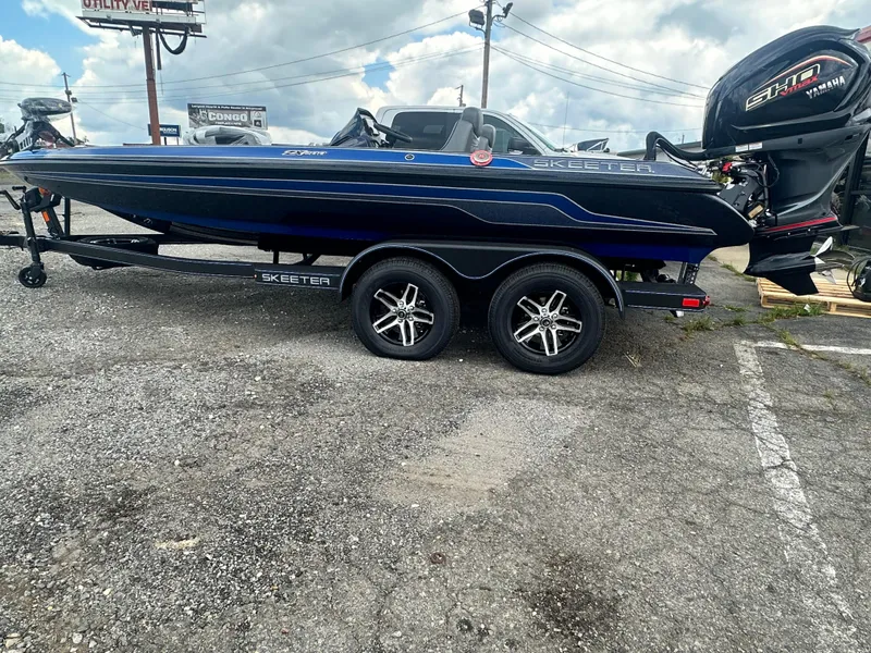 Slide: The Image of 2024 Skeeter ZX200 boat with Yamaha engine on a trailer. - 2