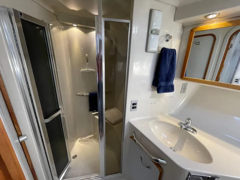 Slide: The Image of Bathroom interior of 1989 Sea Ray 420 yacht with shower and sink. - 17
