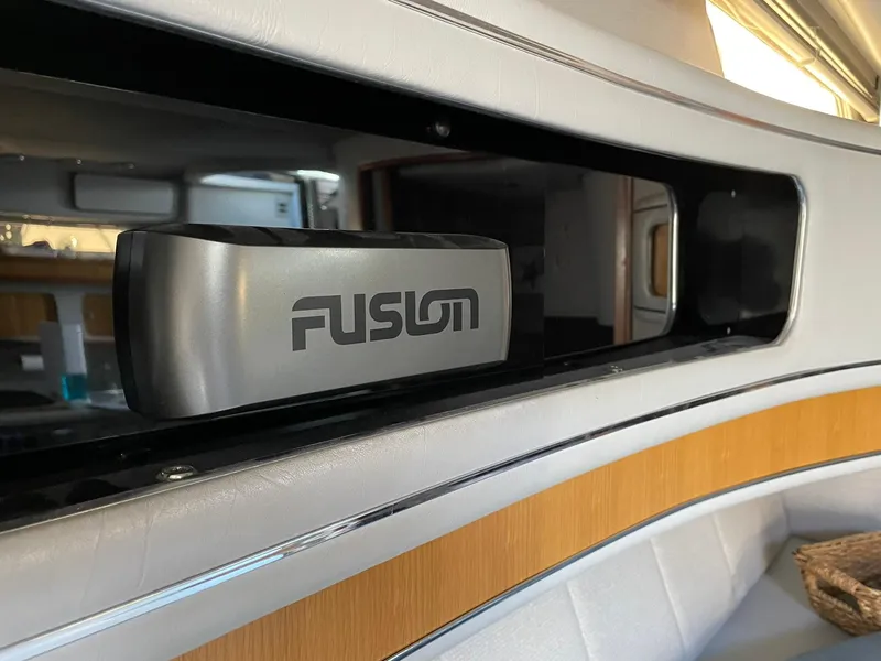 Slide: The Image of Interior of 1989 Sea Ray 420 boat featuring a Fusion audio system. - 20