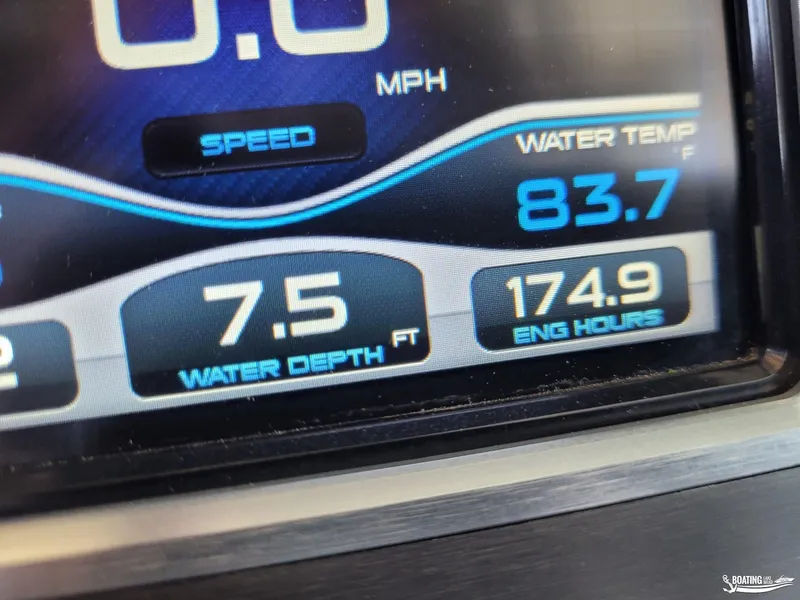 Slide: The Image of Close-up of 2018 MasterCraft XT 22 boat display showing speed, water temperature, depth, and engine hours. - 18