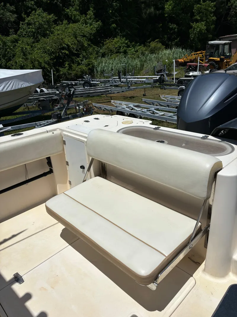 Slide: The Image of 2008 Pursuit S 310 Sport boat with foldable seating in the cockpit area. - 11