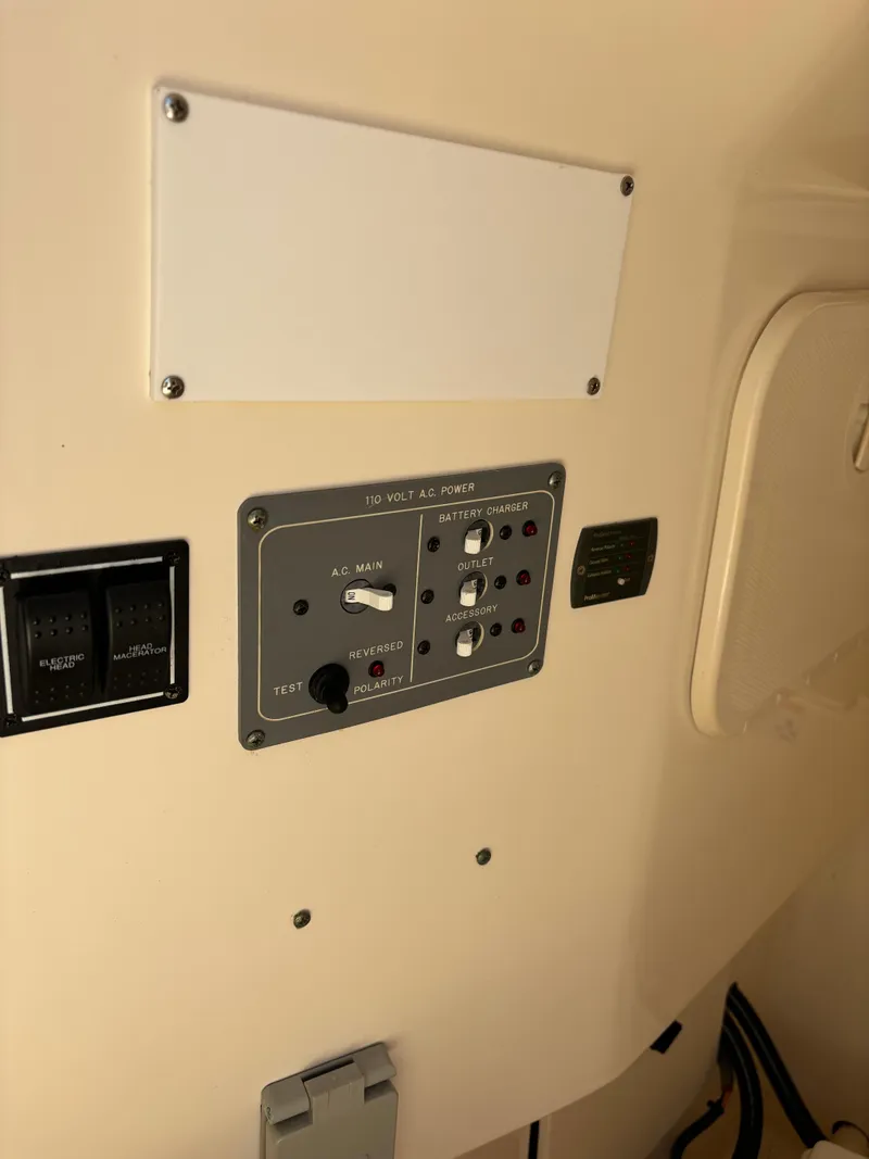 Slide: The Image of Control panel on a 2008 Pursuit S 310 Sport boat. - 15