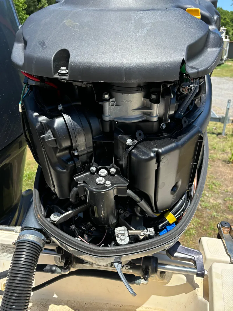 Slide: The Image of Close-up of a 2008 Pursuit S 310 Sport boat engine. - 16