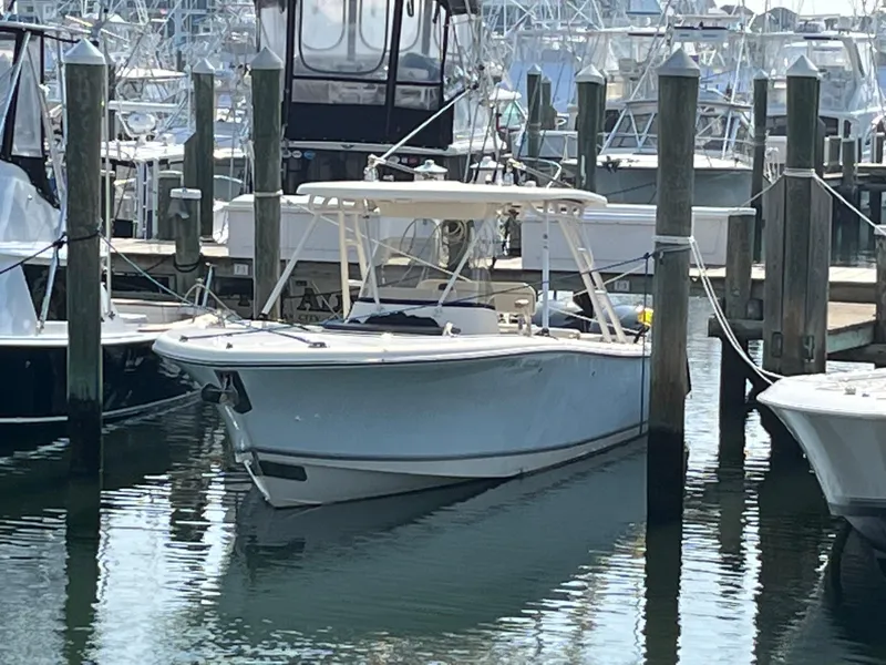 Slide: The Image of 2008 Pursuit S 310 Sport boat docked at a marina. - 3