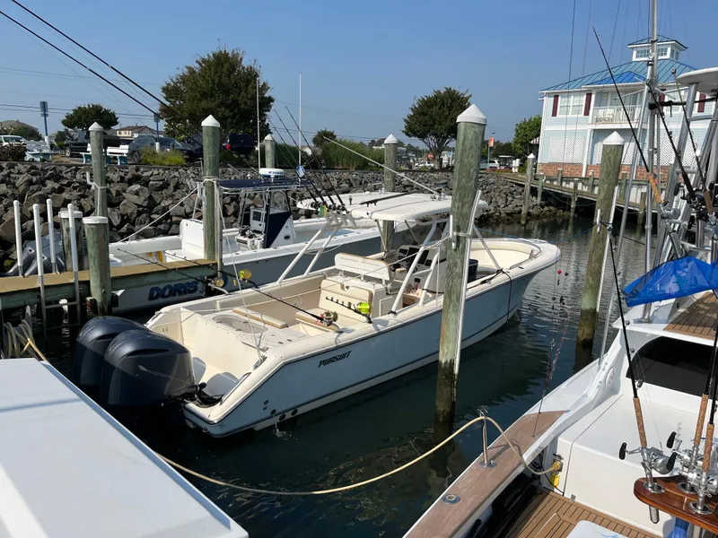 Slide: The Image of 2008 Pursuit S 310 Sport boat docked at a marina. - 4
