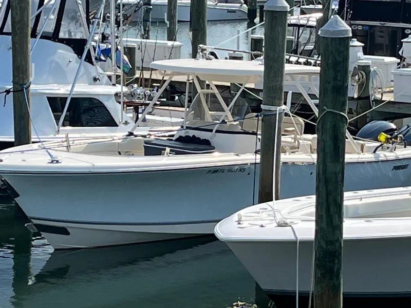 Slide: The Image of 2008 Pursuit S 310 Sport boat docked at a marina. - 5