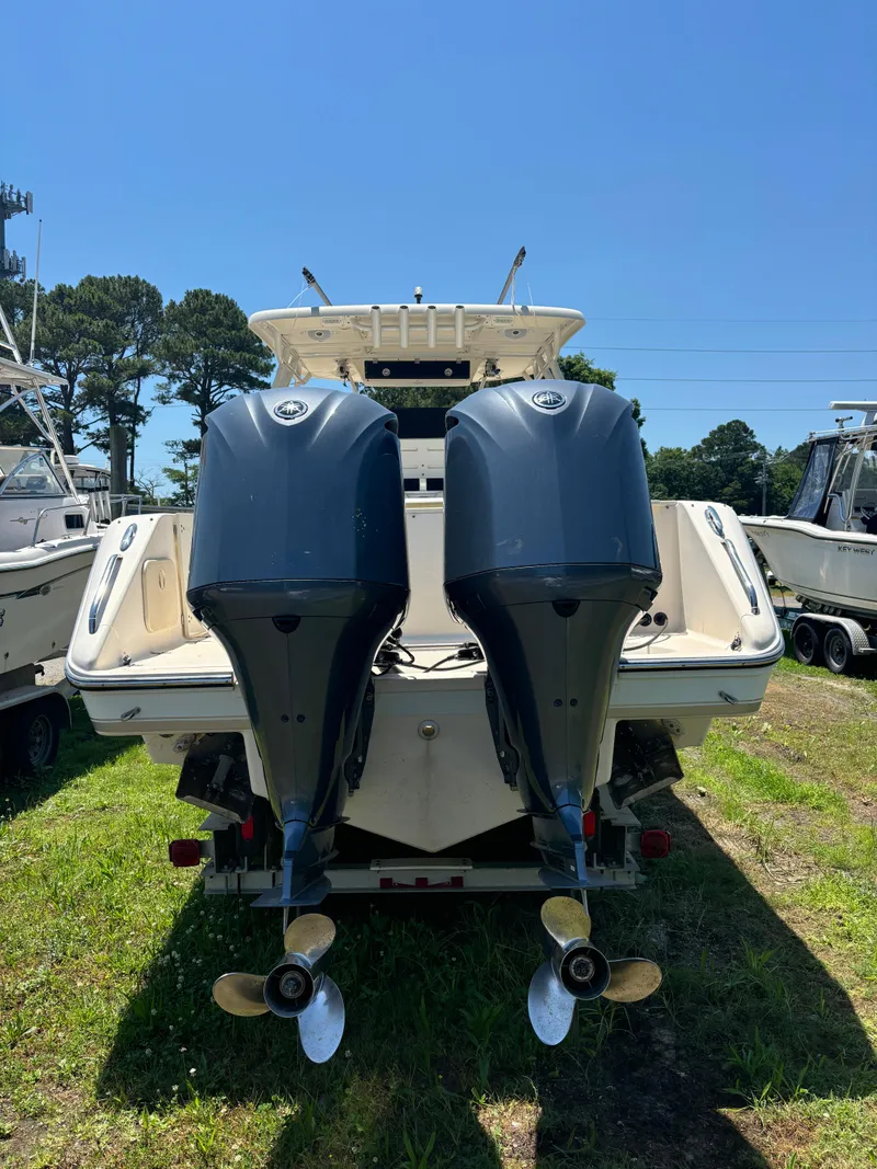 Slide: The Image of 2008 Pursuit S 310 Sport boat with twin outboard engines. - 7