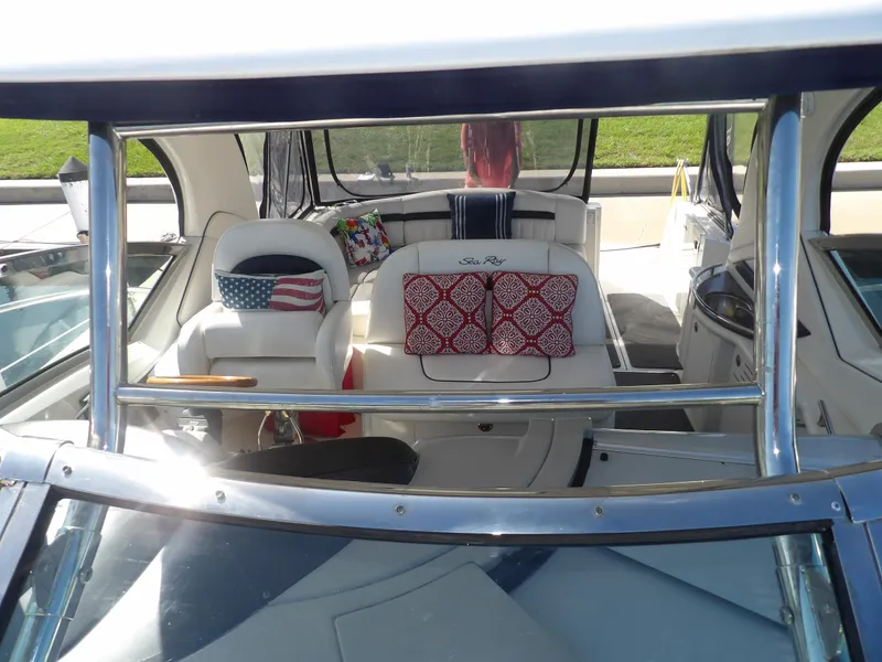 Slide: The Image of 2005 Sea Ray 390 Sundancer interior with patriotic and patterned cushions. - 14
