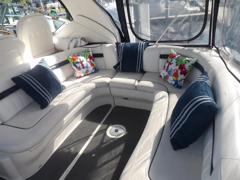 Slide: The Image of Luxurious seating area on a 2005 Sea Ray 390 Sundancer yacht with colorful pillows. - 16