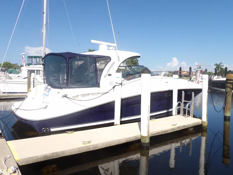 Slide: The Image of 2005 Sea Ray 390 Sundancer docked at marina on a sunny day. - 2