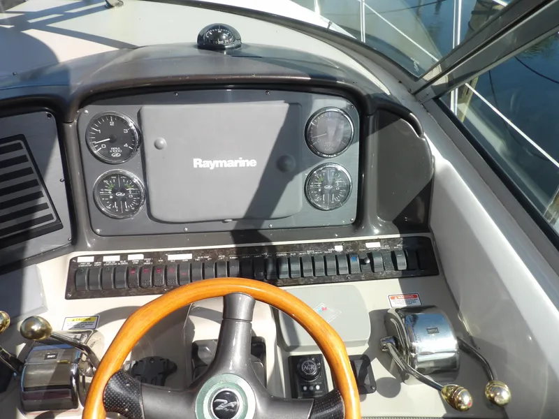 Slide: The Image of 2005 Sea Ray 390 Sundancer helm with Raymarine navigation system. - 22