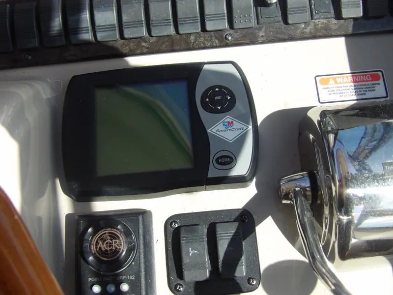 Slide: The Image of Close-up of the control panel on a 2005 Sea Ray 390 Sundancer boat. - 26