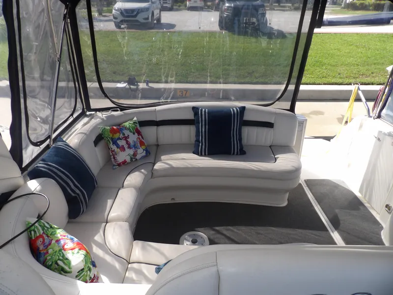 Slide: The Image of Interior seating area of a 2005 Sea Ray 390 Sundancer yacht with colorful cushions. - 27