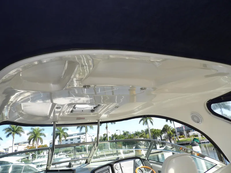 Slide: The Image of 2005 Sea Ray 390 Sundancer cockpit roof with marina view. - 29