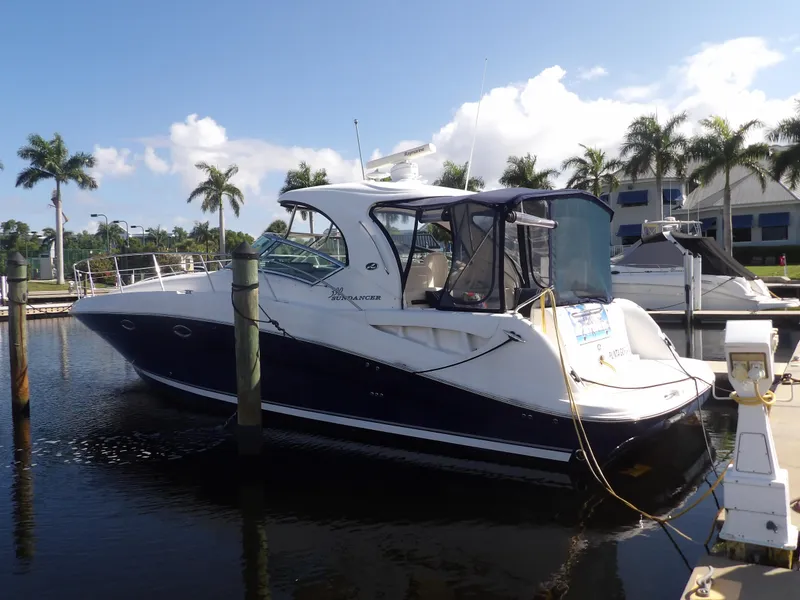 Slide: The Image of 2005 Sea Ray 390 Sundancer yacht docked at marina with palm trees. - 3