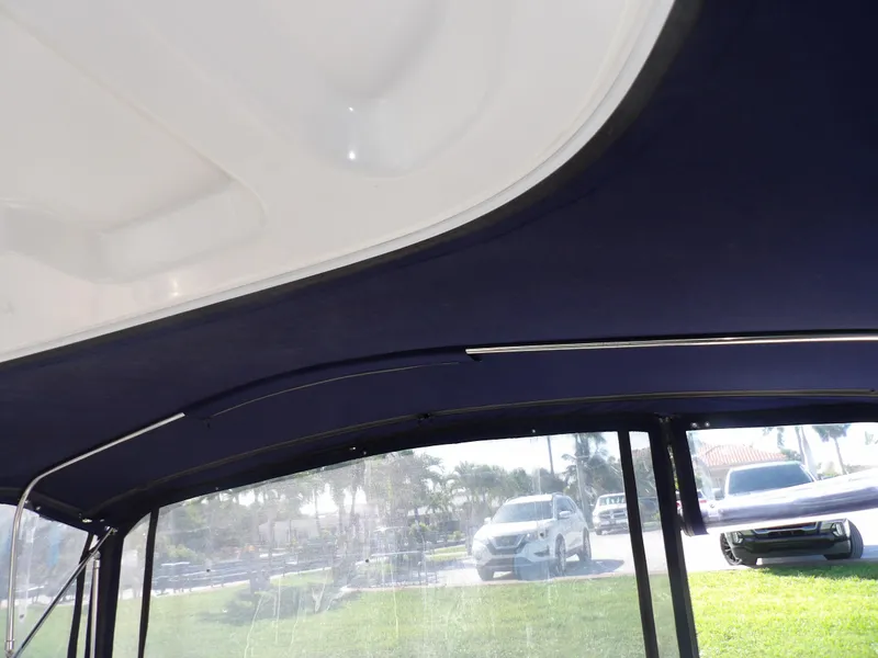 Slide: The Image of Interior view of 2005 Sea Ray 390 Sundancer boat with blue canopy. - 30