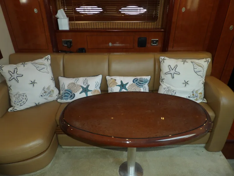 Slide: The Image of Luxurious interior of 2005 Sea Ray 390 Sundancer with leather sofa and decorative pillows. - 34