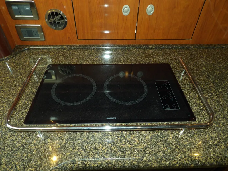 Slide: The Image of Electric stovetop in the galley of a 2005 Sea Ray 390 Sundancer yacht. - 38