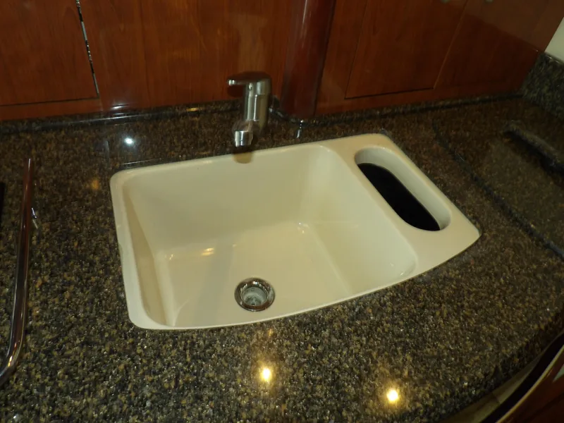 Slide: The Image of 2005 Sea Ray 390 Sundancer kitchen sink with granite countertop - 40