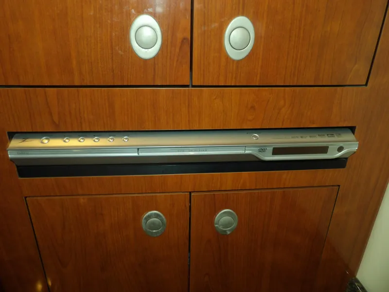 Slide: The Image of Built-in DVD player on 2005 Sea Ray 390 Sundancer yacht with wooden cabinetry. - 41