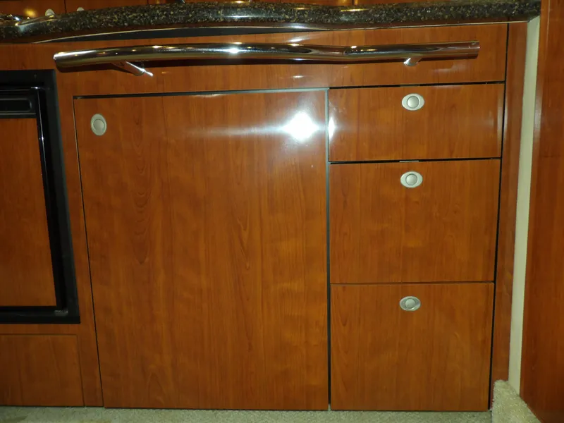 Slide: The Image of Wooden cabinetry in the 2005 Sea Ray 390 Sundancer yacht kitchen. - 42