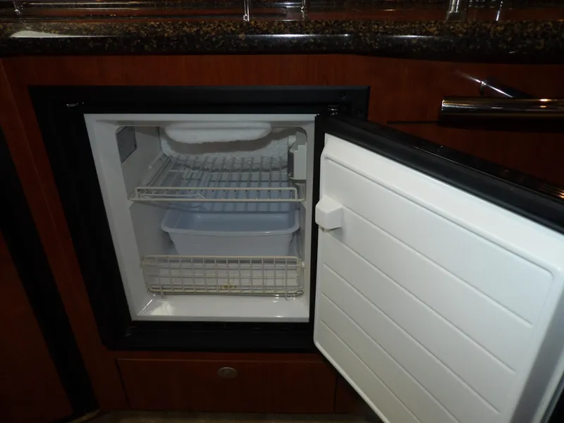 Slide: The Image of Open mini fridge in 2005 Sea Ray 390 Sundancer yacht kitchen. - 44