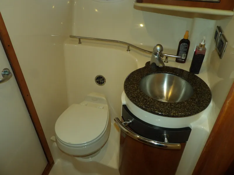 Slide: The Image of 2005 Sea Ray 390 Sundancer bathroom with modern sink and toilet. - 46