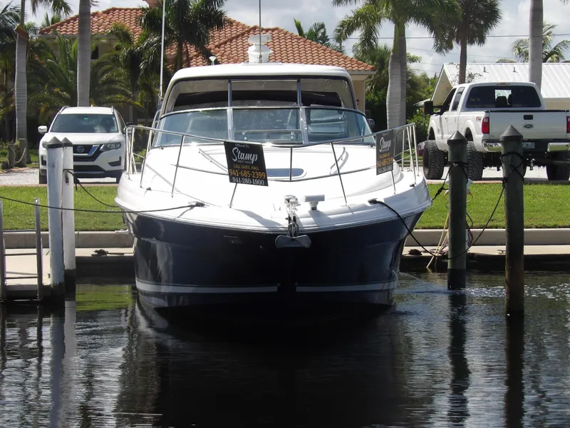 Slide: The Image of 2005 Sea Ray 390 Sundancer docked at marina, front view. - 5