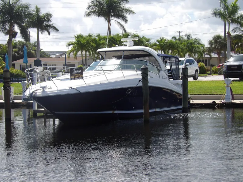 Slide: The Image of 2005 Sea Ray 390 Sundancer docked at marina with palm trees. - 6